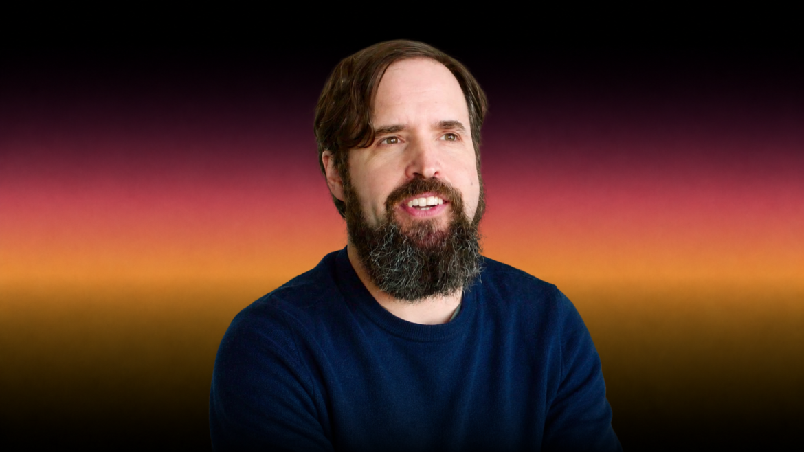 Duncan Trussell smiling during a podcast recording, highlighting Duncan Trussell age, comedy career, and The Midnight Gospel creator.